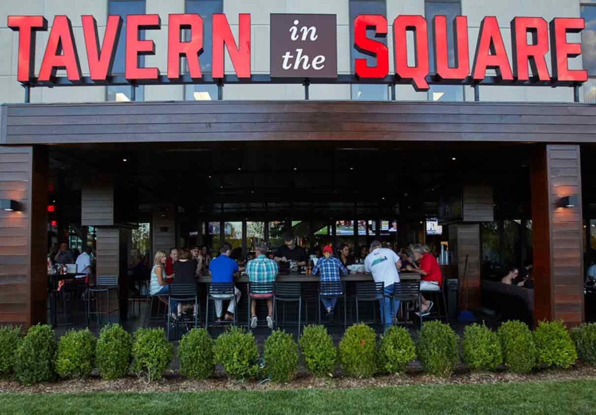 Tavern in the Square sign and open-to-the-outside bar