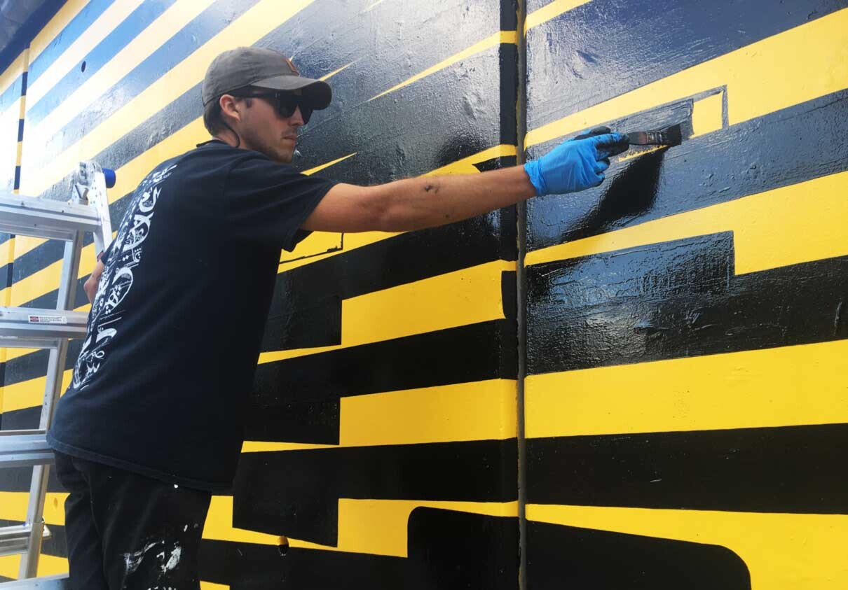 Artist paints the Underground mural